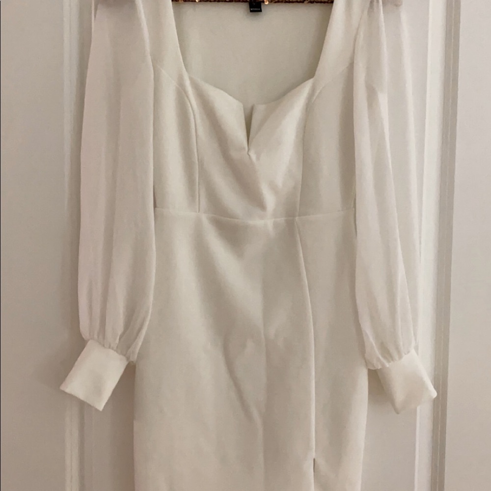 White bodycon mini dress.